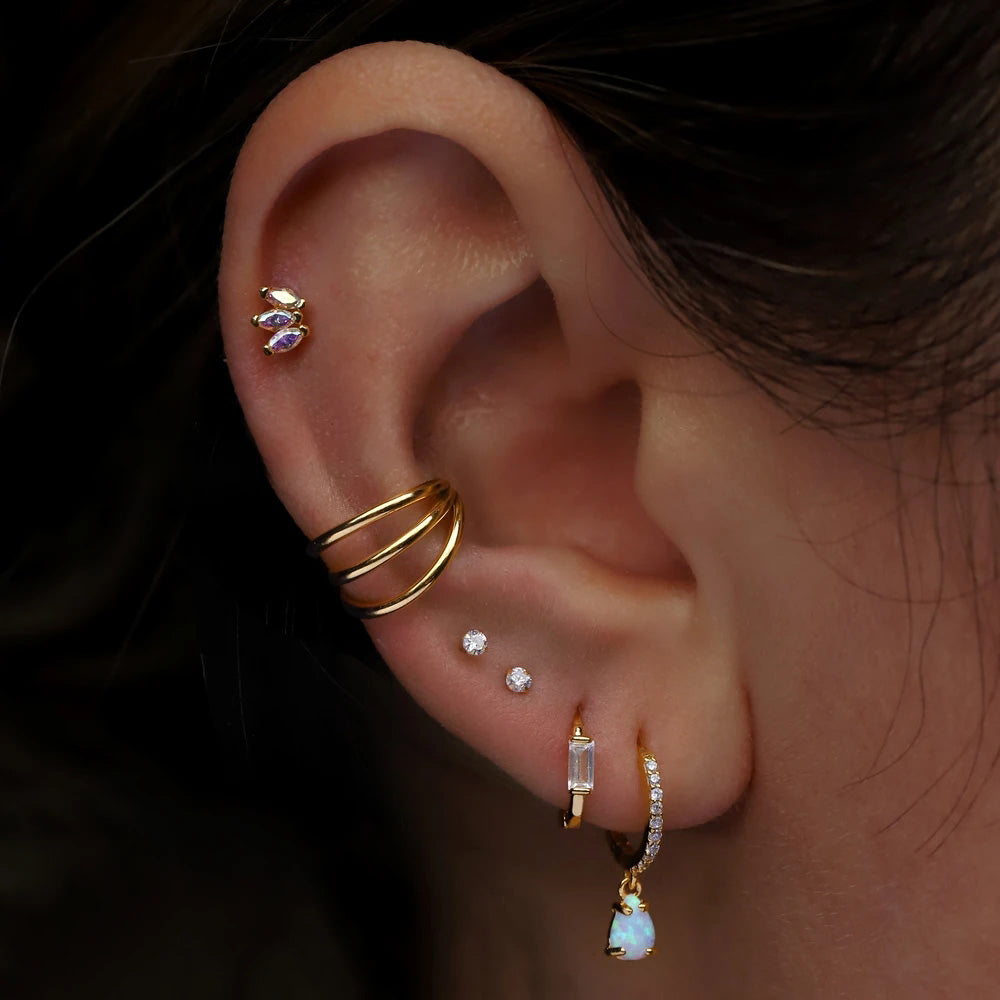 piercing triple anneaux helix doré porté femme