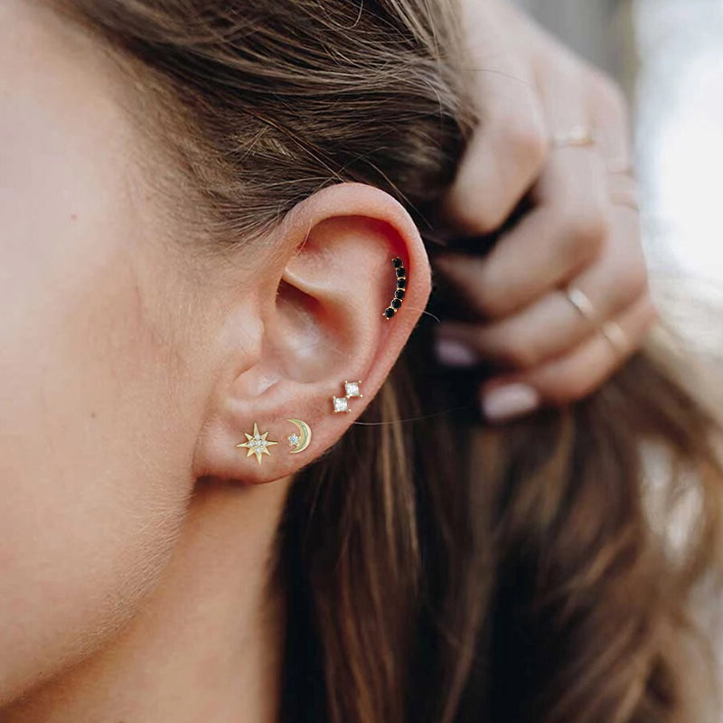 Piercing Oreille Soleil porté sur une oreille féminine.