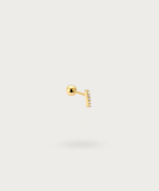 Vue rapprochée du Piercing Flat Labret avec Zircons doré